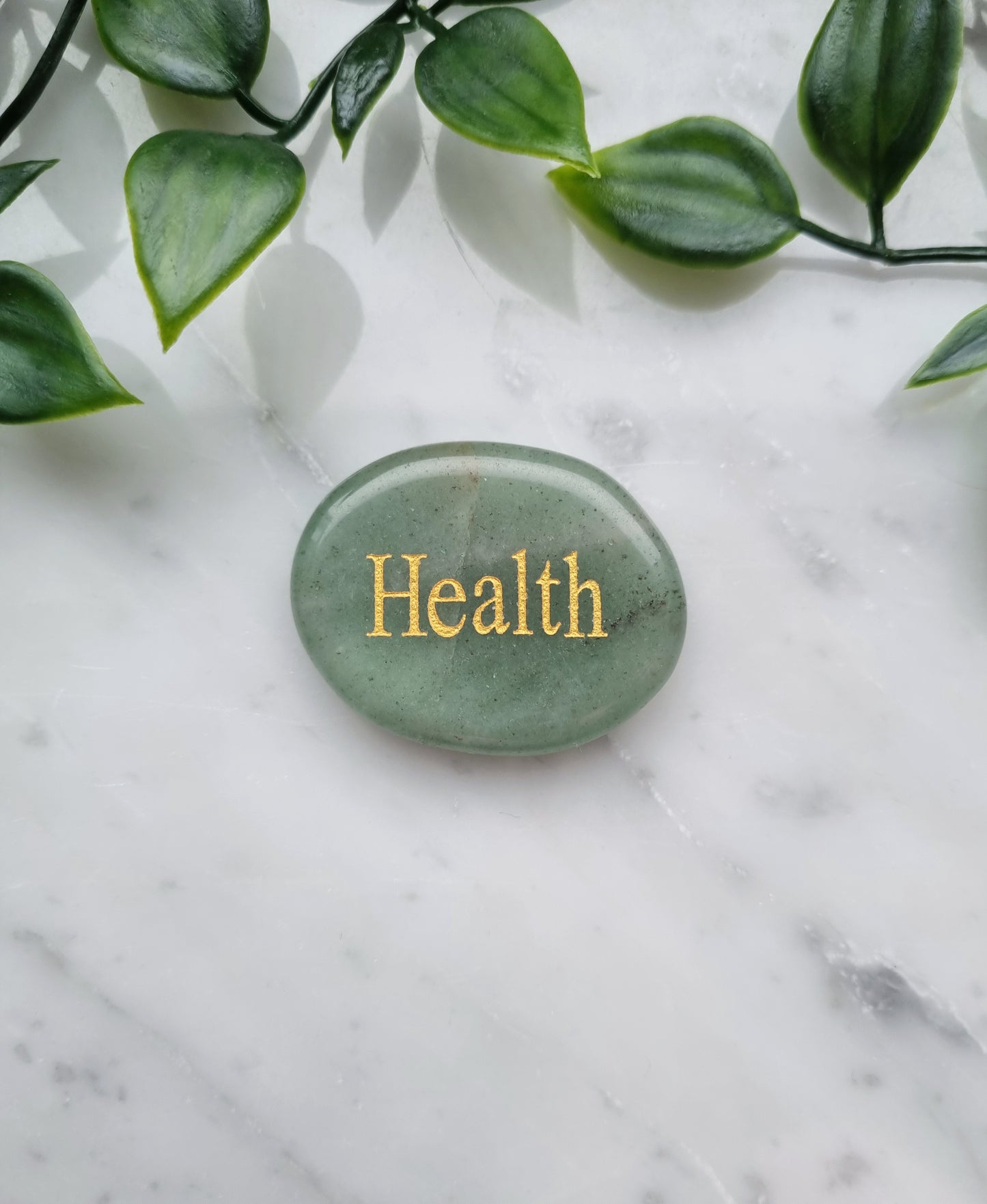 Handsten med Aventurin och ordet "Health"