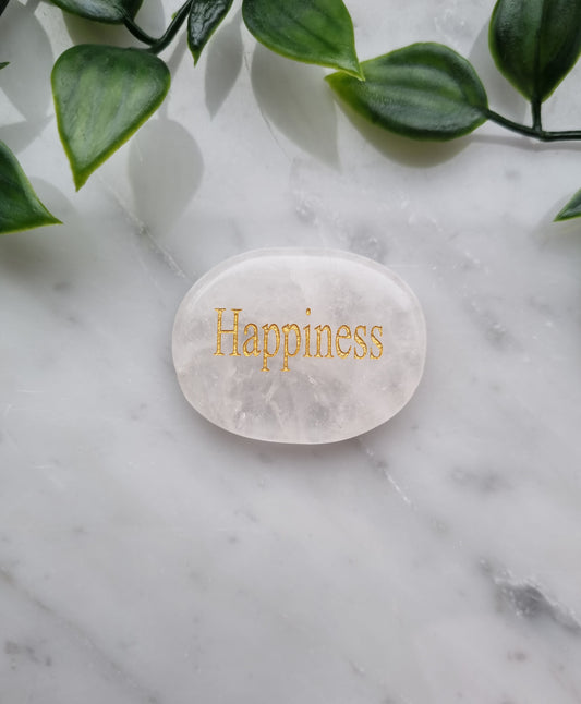 Handsten med Bergkristall och ordet " Happiness"